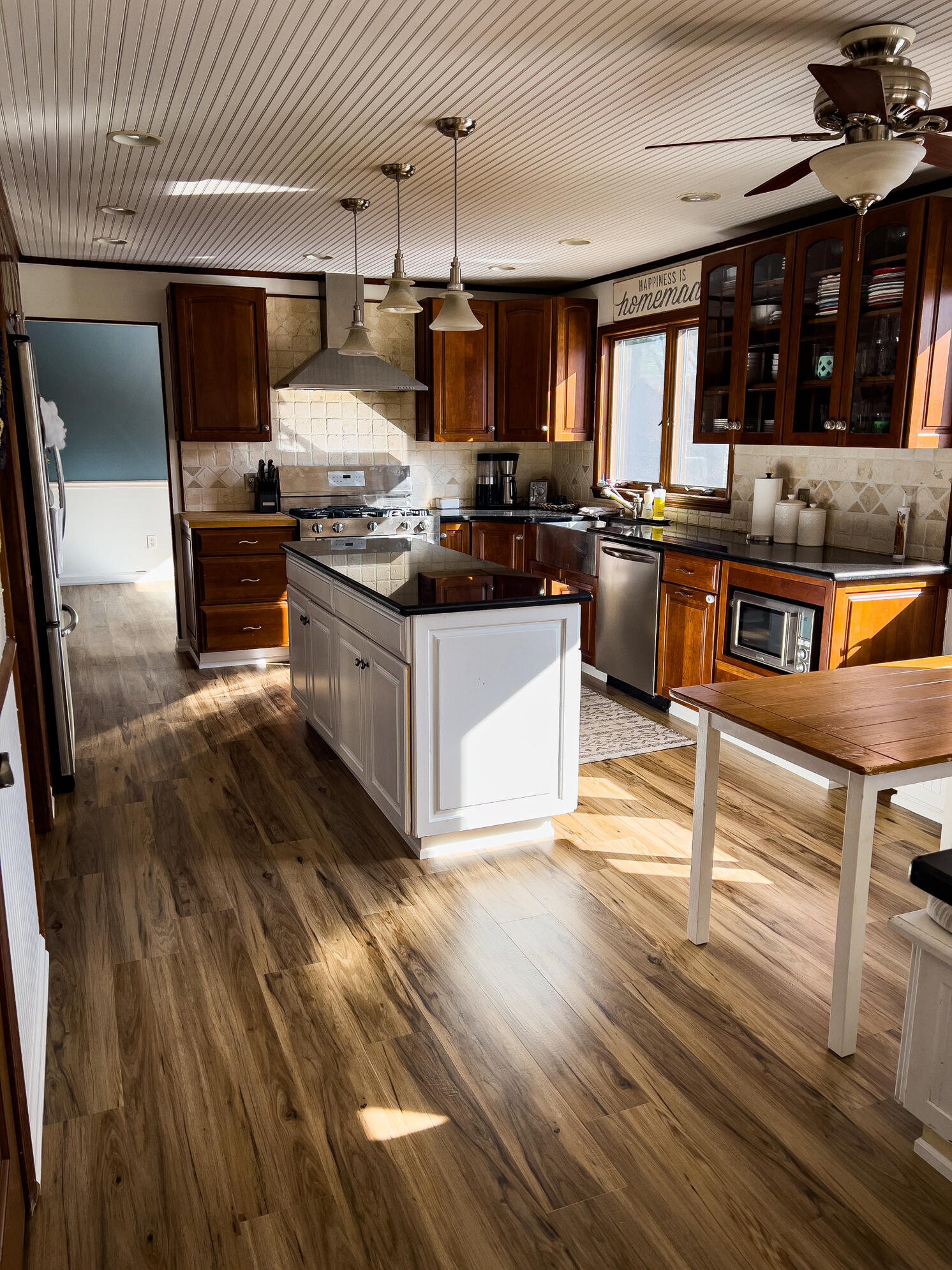 Kitchen Remodeling – Dymond Building Co. Modern kitchen remodel with custom cabinetry and granite countertops by Dymond Building Co. in Troy, MI